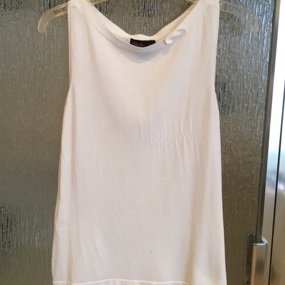 Dressy white sleeveless sweater with bow